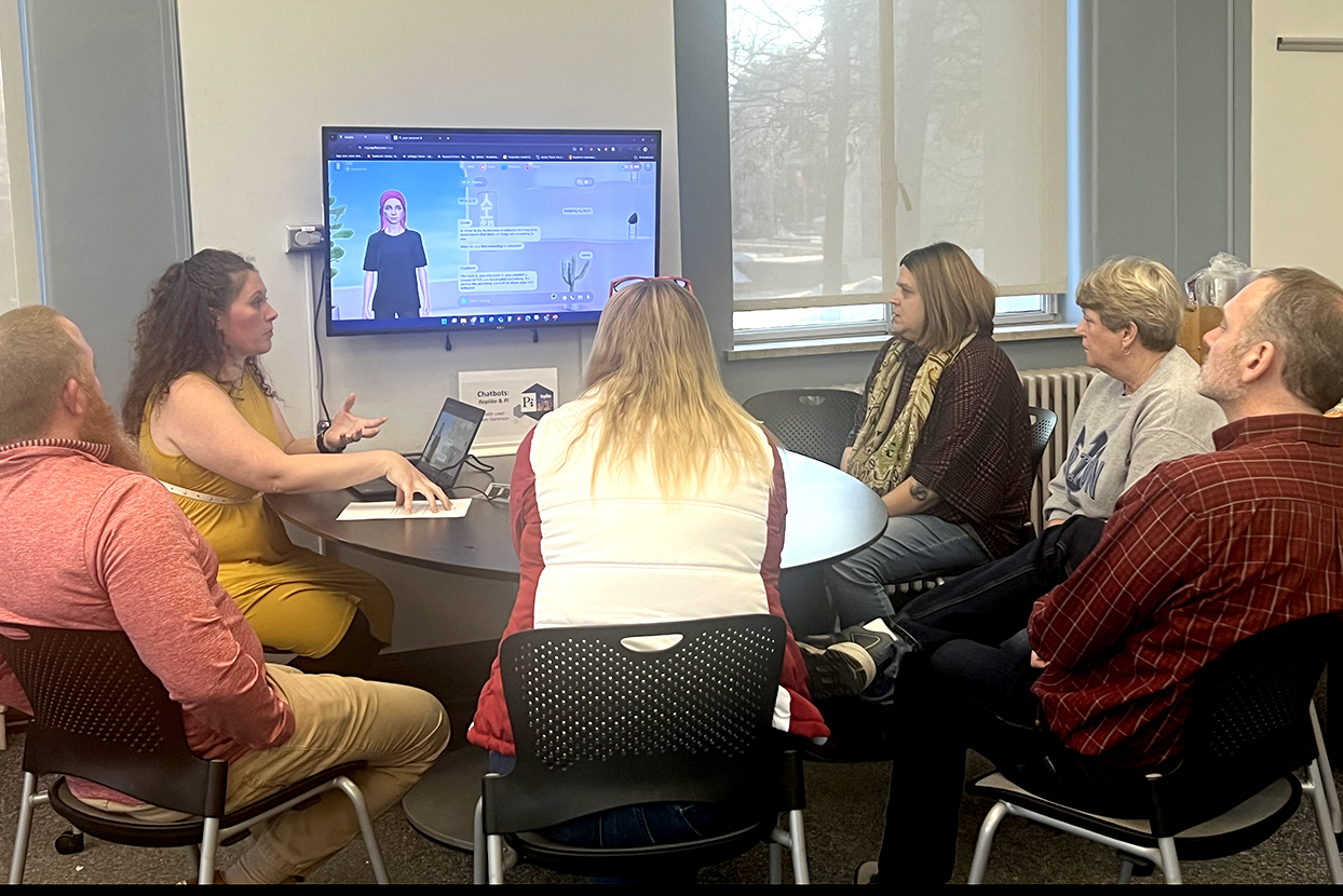 librarians gather around a screen displaying an AI avatar 